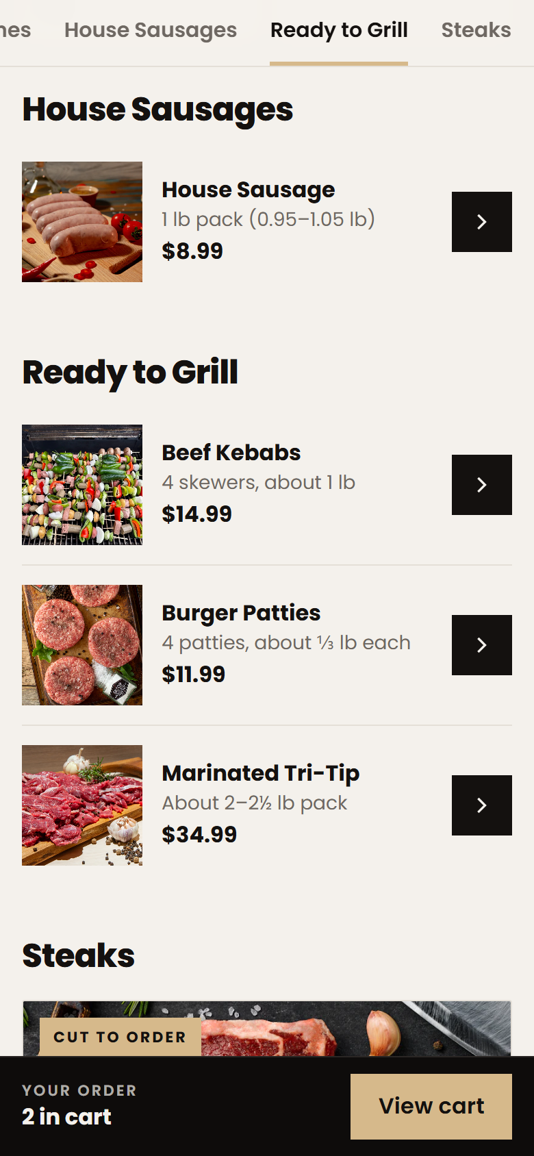 The Meat Up ordering menu on a phone with house sausage and ready-to-grill packs, prices, and a cart bar